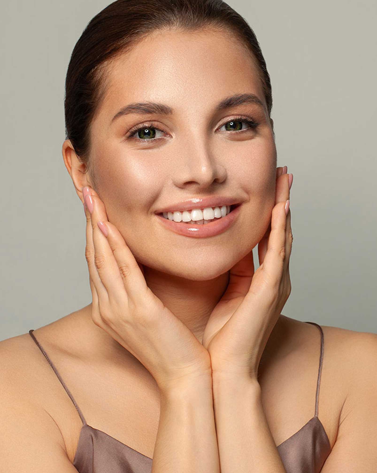 Woman touching her face with both hands