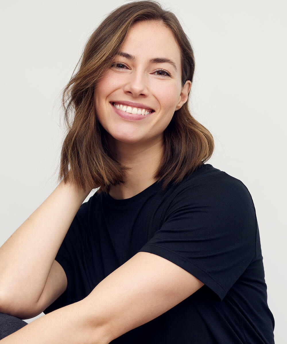 woman smiling wearing a blue shirt