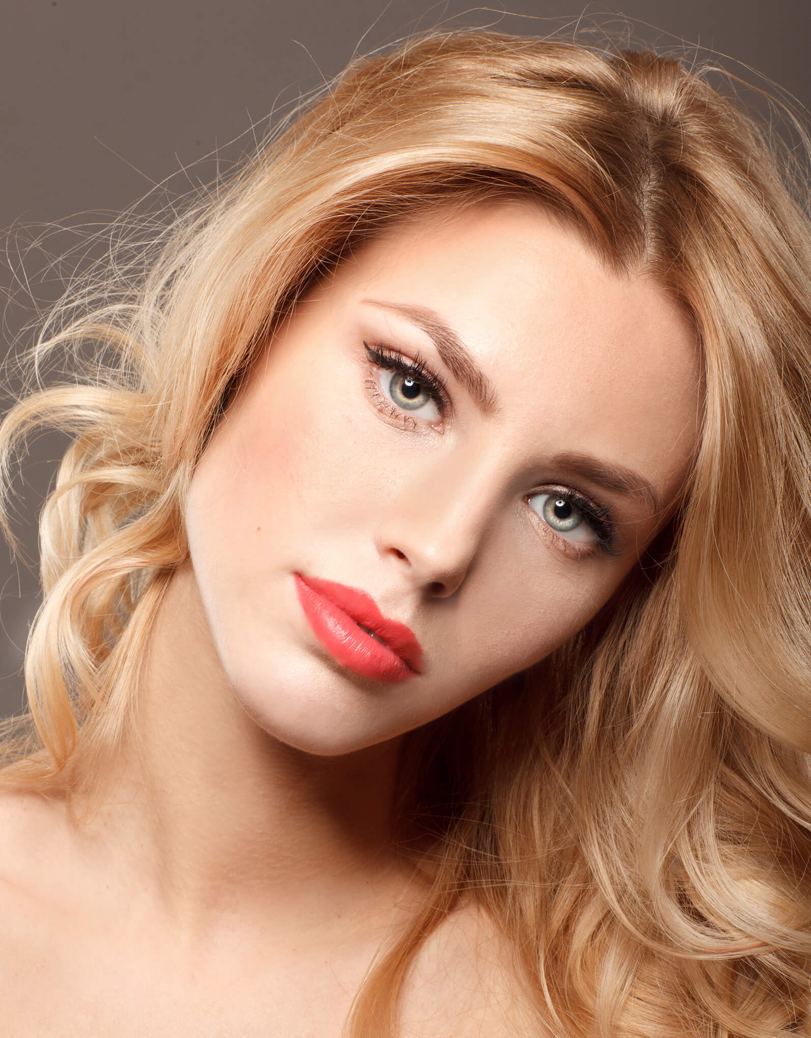 young woman with blonde hair and beautiful green eyes